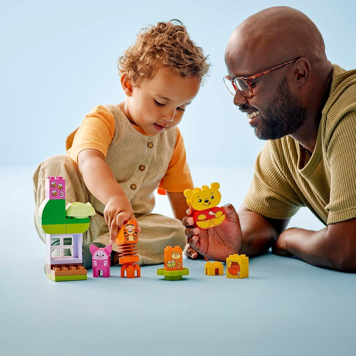 LEGO DUPLO - Disney Winnie the Pooh's Birthday Party - jucărie educativă pentru preșcolari - set cu 3 minifigurine, inclusiv Winnie the Pooh, Tigger și Piglet - idee de cadou pentru băieți și fete de la 1,5 ani 10457