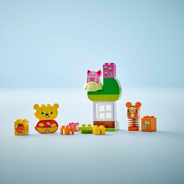 LEGO DUPLO - Disney Winnie the Pooh's Birthday Party - jucărie educativă pentru preșcolari - set cu 3 minifigurine, inclusiv Winnie the Pooh, Tigger și Piglet - idee de cadou pentru băieți și fete de la 1,5 ani 10457