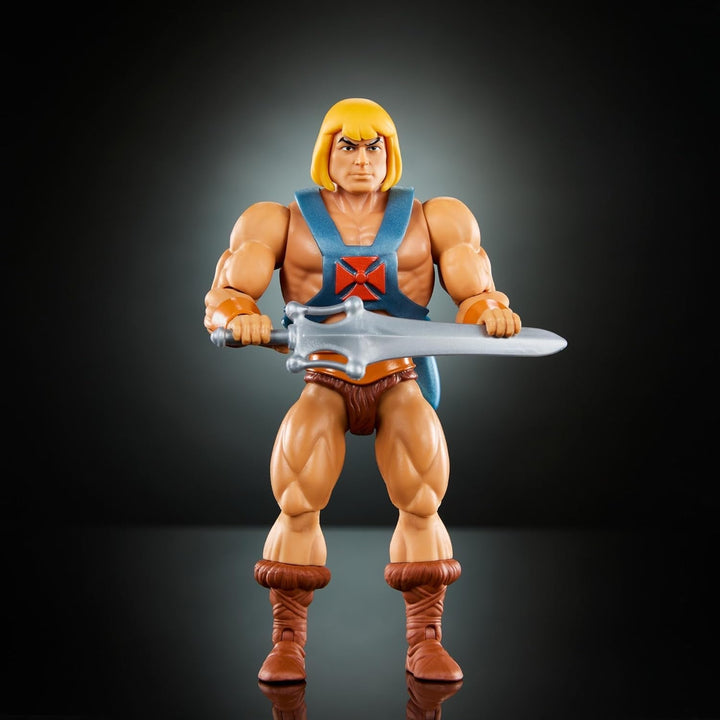 Jucărie Masters of the Universe Origins, He-Man figurină de acțiune din colecția de desene animate, la scară reală, aprox. 14 cm înălțime, erou cu armură, 2 săbii și mini benzi desenate, HYD17