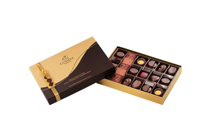 Ciocolată Godiva Connoisseur combinată cu fructul pasiunii, mousse de vanilie, caramel și alte umpluturi delicioase 